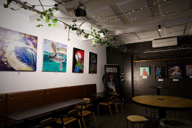 Explore The Early Works — expressive portraits and animal paintings from Kelly Batsiokis’ early collections, signed with her initials and full of vibrant energy.