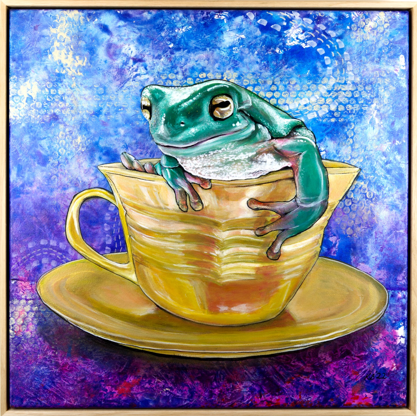 Original painting of a frog in a blue and white patterned teacup with a golden halo, framed in natural Tasmanian oak.
