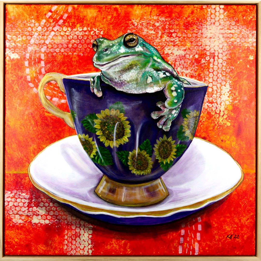 Original painting of a frog in a blue and white patterned teacup with a golden halo, framed in natural Tasmanian oak.