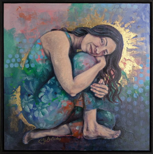 A framed square mixed media painting depicting a curled female figure resting inward, holding her knees close to her chest. Her skin is softly rendered in warm tones, surrounded by layered blues, greens, and subtle floral forms. A halo of gold foil radiates behind her head, contrasting with the textured background. The artwork conveys stillness, tenderness, and quiet strength, presented in a matte black oak float frame.
