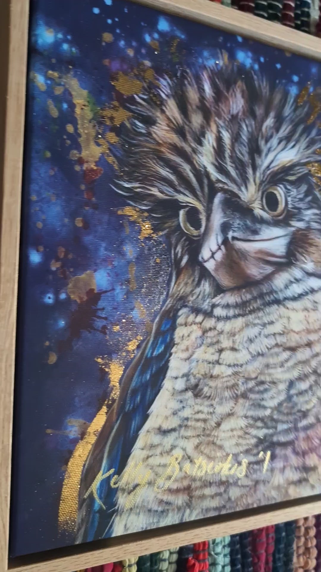 Video of framed fine art embellished print of Bazza the Kookaburra showing the quality of the oak frame and the glint of the gold-like leaf in 3D.