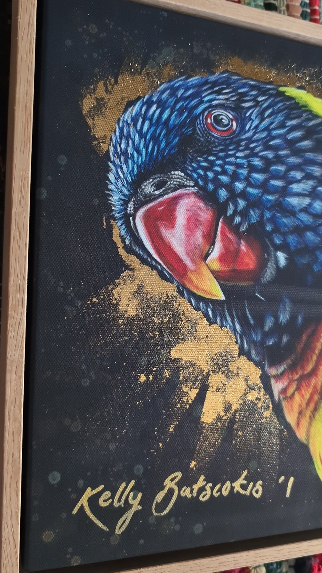 Video of framed embellished print of Shazza the Rainbow Lorikeet by Kelly Batsiokis showing the frame quality and also the effect of the gold-like foil in 3D.